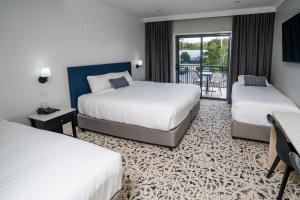 Warners at the Bay客房内的一张或多张床位