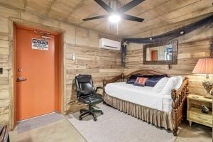 a bedroom with a bed and a desk and a chair at Casas Coastal Experience Cabin A in Rockport