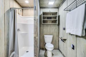 a bathroom with a toilet and a tub and a sink at Casas Coastal Experience Cabin C in Rockport +39 photos
