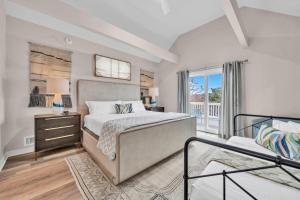a bedroom with a large bed and a balcony at Blue Mountain Home with 2 Masters and a Private Pool while only 300 ft to Beach in Santa Rosa Beach +40 photos