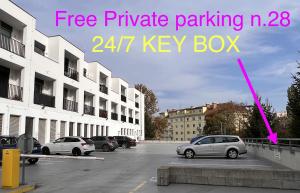 a car parked in a parking lot next to buildings at DH Private Flowers Terrace and Sauna Luxury Apartment 2kk, 2x SmartTV-NETFLIX, Free Parking, Gym in Brno