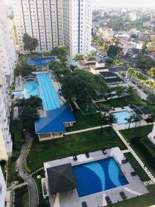 an aerial view of a city with two swimming pools at SMDC 1 BR Grass Residence Tower 3 North Ave., QC in Manila
