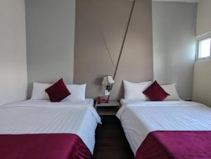 Postel nebo postele na pokoji v ubytování Vy Anh Đà Lạt Hotel