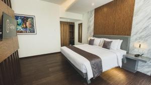 Postel nebo postele na pokoji v ubytování LPP Garden Hotel