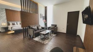 Postel nebo postele na pokoji v ubytování LPP Garden Hotel
