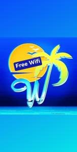 uma imagem de um sinal de wi-fi gratuito com uma palmeira em Westpoint Inn em San Vicente