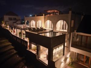 an aerial view of a building at night at Alsava Villa and Suites Canggu in Canggu