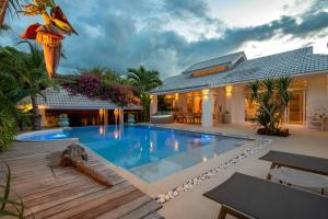 a swimming pool in the backyard of a house at Luxury Villa MISS KOH Bophut in Koh Samui 