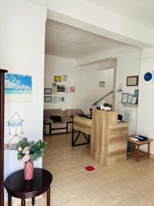 a living room with a couch and a table at Perla in Costinesti