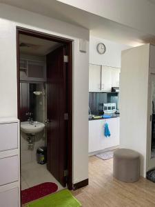 an open door to a kitchen with a sink at condotel anuva in Manila