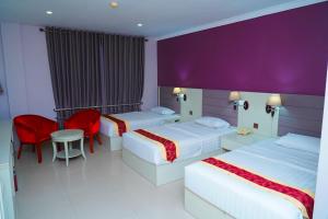 Voodi või voodid majutusasutuse Tilko City Hotel Jaffna toas
