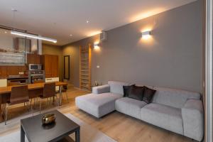 a living room with a couch and a table at Laurinska modern apartment in direct centrum of Bratislava, Air-condition in Bratislava