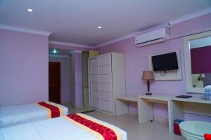 Voodi või voodid majutusasutuse Tilko City Hotel Jaffna toas