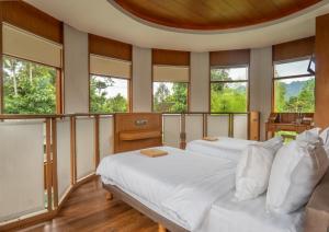 Giường trong phòng chung tại Hotel Le Temple Borobudur