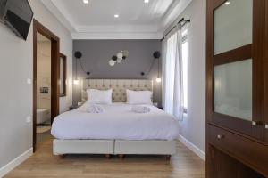 Postel nebo postele na pokoji v ubytování Nival Luxury Suites