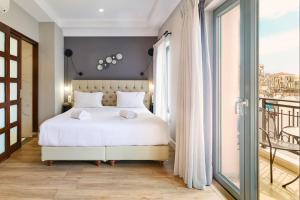 Postel nebo postele na pokoji v ubytování Nival Luxury Suites