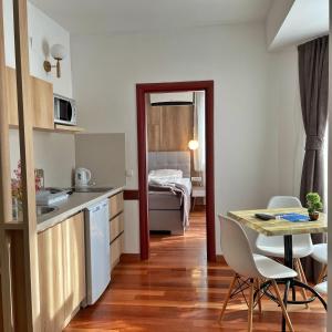 a kitchen and dining room with a table and chairs at Villa Pestani in Peštani