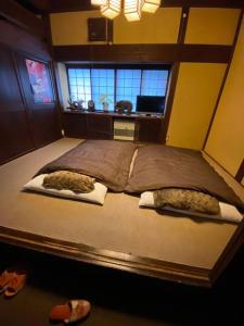 Cama ou camas em um quarto em 民泊Azoo