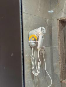 a blow dryer is attached to a wall at Golden mountains camp in Wadi Rum