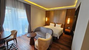 Voodi või voodid majutusasutuse Minerva Premium Hotel toas