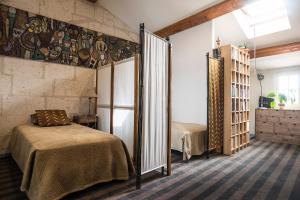 Postel nebo postele na pokoji v ubytování Les Jardins suspendus