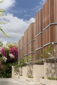 an architectural rendering of a building with flowers at VOX Villas Canggu in Canggu
