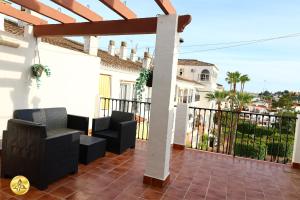 a balcony with black chairs and a fence at A4J Luxury in Mijas