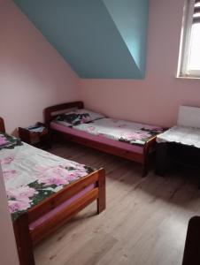 Ένα ή περισσότερα κρεβάτια σε δωμάτιο στο Villa pod gruszą