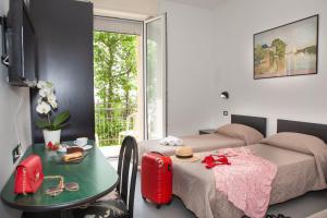 Postel nebo postele na pokoji v ubytování Hotel La Torretta Bramante