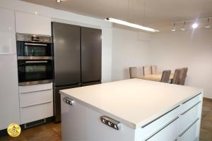 a kitchen with a white counter and a black refrigerator at Mijas Room A4J in Mijas