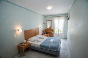 Postel nebo postele na pokoji v ubytování Hotel Argo