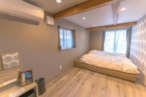 A bed or beds in a room at 香季庵Euphoria