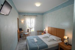 Postel nebo postele na pokoji v ubytování Hotel Argo