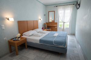 Postel nebo postele na pokoji v ubytování Hotel Argo