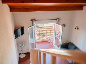 Televisyen dan/atau pusat hiburan di Appartement de charme avec vue mer époustouflante