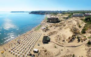 an aerial view of a beach with umbrellas at Favorit Aparthotel in Sunny Beach