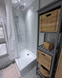 a bathroom with a shower and a walk in shower at The Cosy House in Brussels