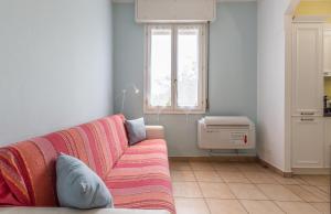 a living room with a couch and a window at Da Birba a Casinalbo Affitti Brevi Italia in Casinalbo