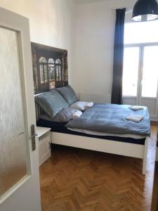 Postel nebo postele na pokoji v ubytování Apartman Kryštof