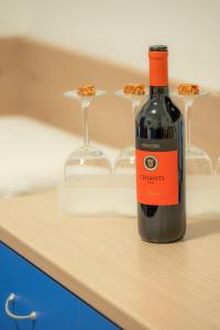 a bottle of red wine sitting on a counter at Affittacamere del Golfo e delle 5 Terre in La Spezia