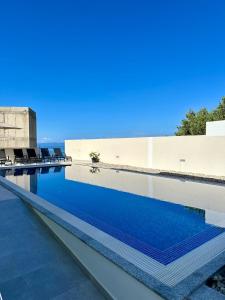 a swimming pool with blue water on top of a building at Holiday Home Meri in Makarska