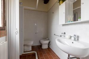 a bathroom with a sink and a toilet at Residence Montevecchio in Montopoli in Val dʼArno