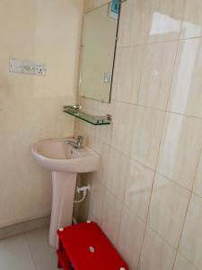 a bathroom with a sink and a mirror at Star Night stay family Studio AC Apartment in Dhaka