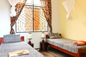 Postel nebo postele na pokoji v ubytování BABA AFRICA HOSTEL