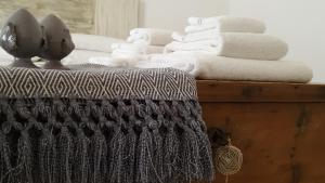 a pile of towels sitting on top of a table at Masseria Spartivento in Melendugno +131 photos