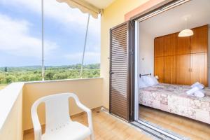 Postel nebo postele na pokoji v ubytování Lotus Apartment 5