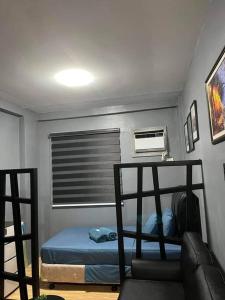 Łóżko lub łóżka piętrowe w pokoju w obiekcie #38 Finihomes Marulas Valenzuela