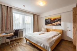 Łóżko lub łóżka w pokoju w obiekcie Appartements Herold