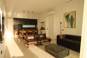 a living room with a couch and a table at Ashta Suites / Color Block in Fethiye