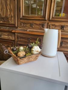 a basket of vegetables sitting on top of a table at Villa ANGEL in Rapallo